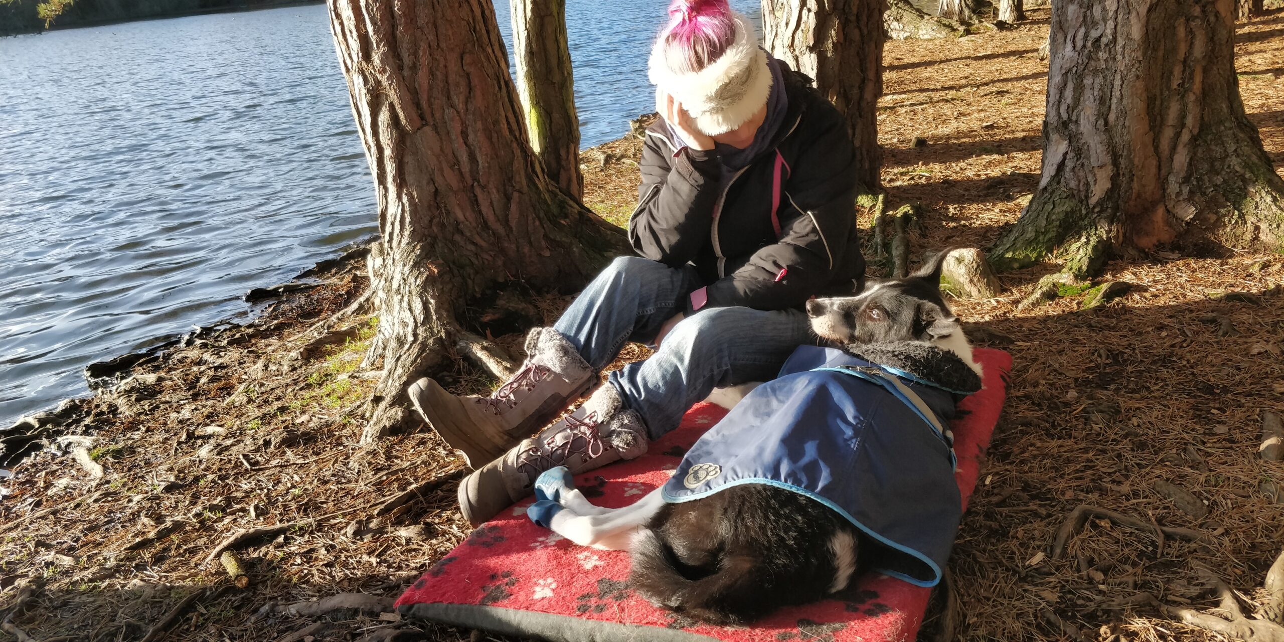 A photo of Logan and I sat on the ground. I just sat with him and had a chat by the lake. Such Peace in those final days